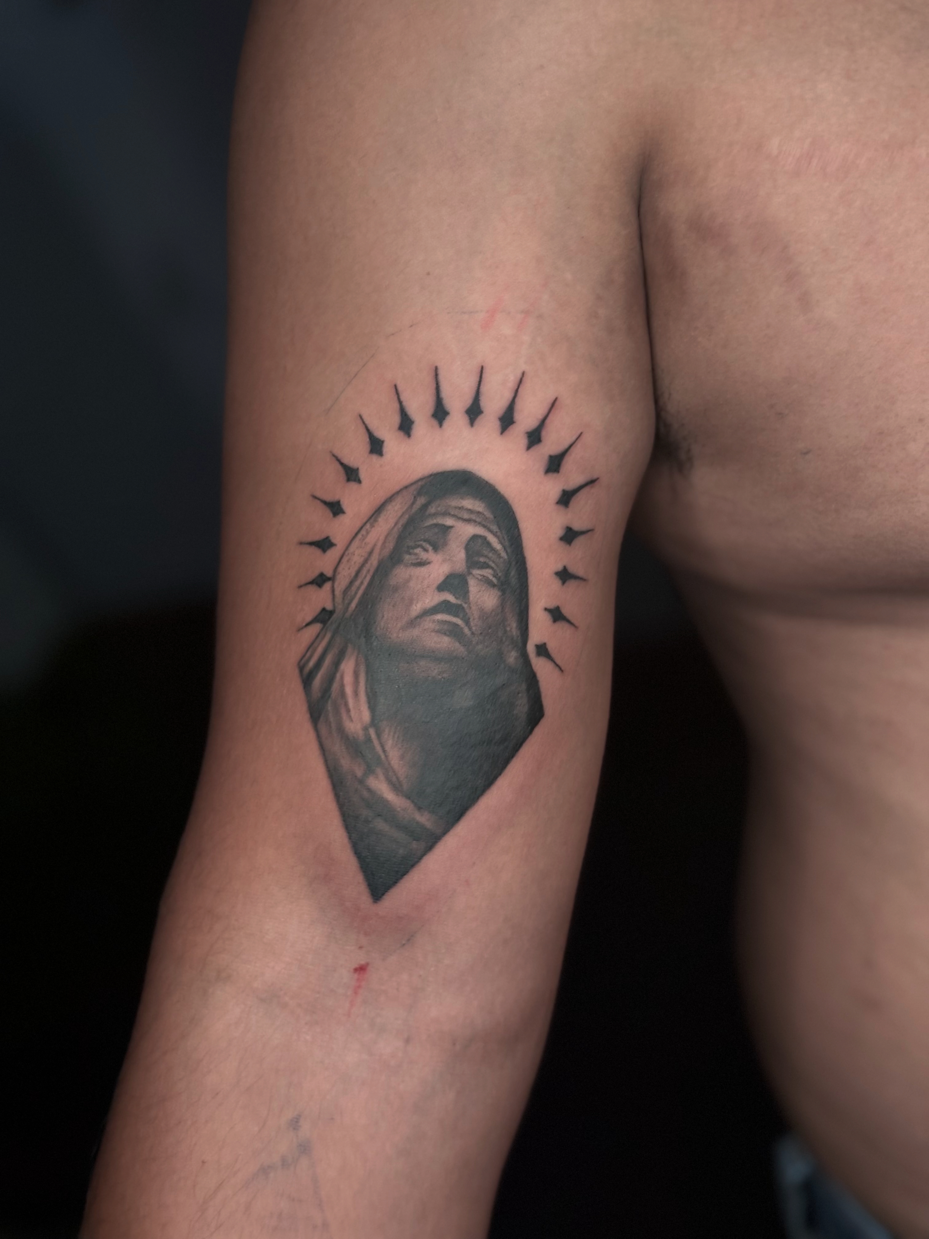 Tatuaje rostro sagrado